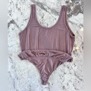 Lulu’s Basics Bodysuit” in color dusty rose. Size SMALL.